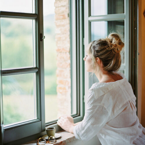 woman looking out of a window