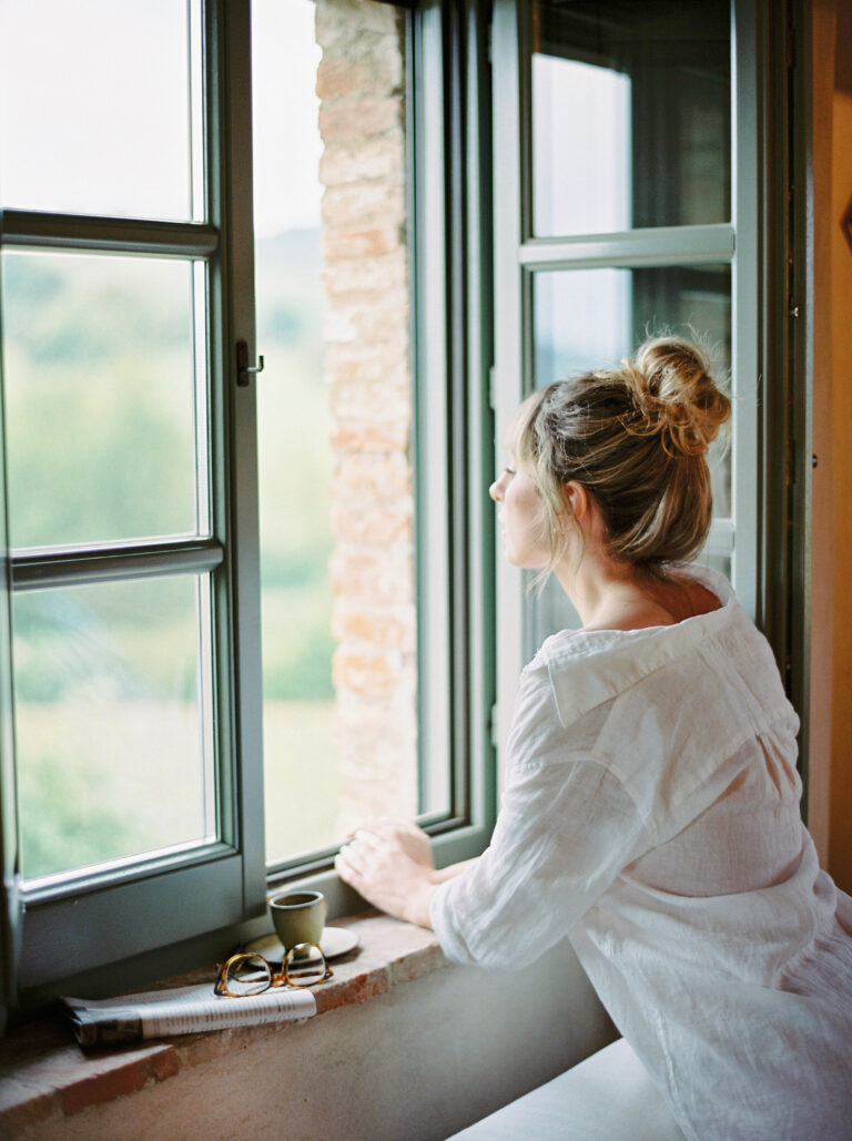 woman looking out of a window