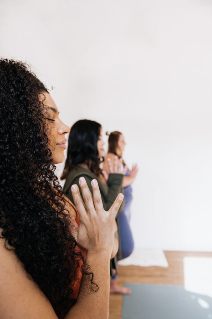 women performing body scan meditation