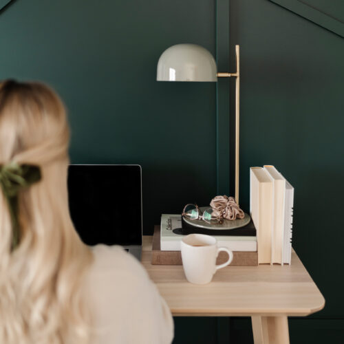 woman sitting at desk setting healthy boundaries at work