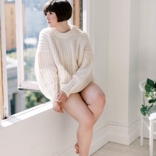 woman looking out a window