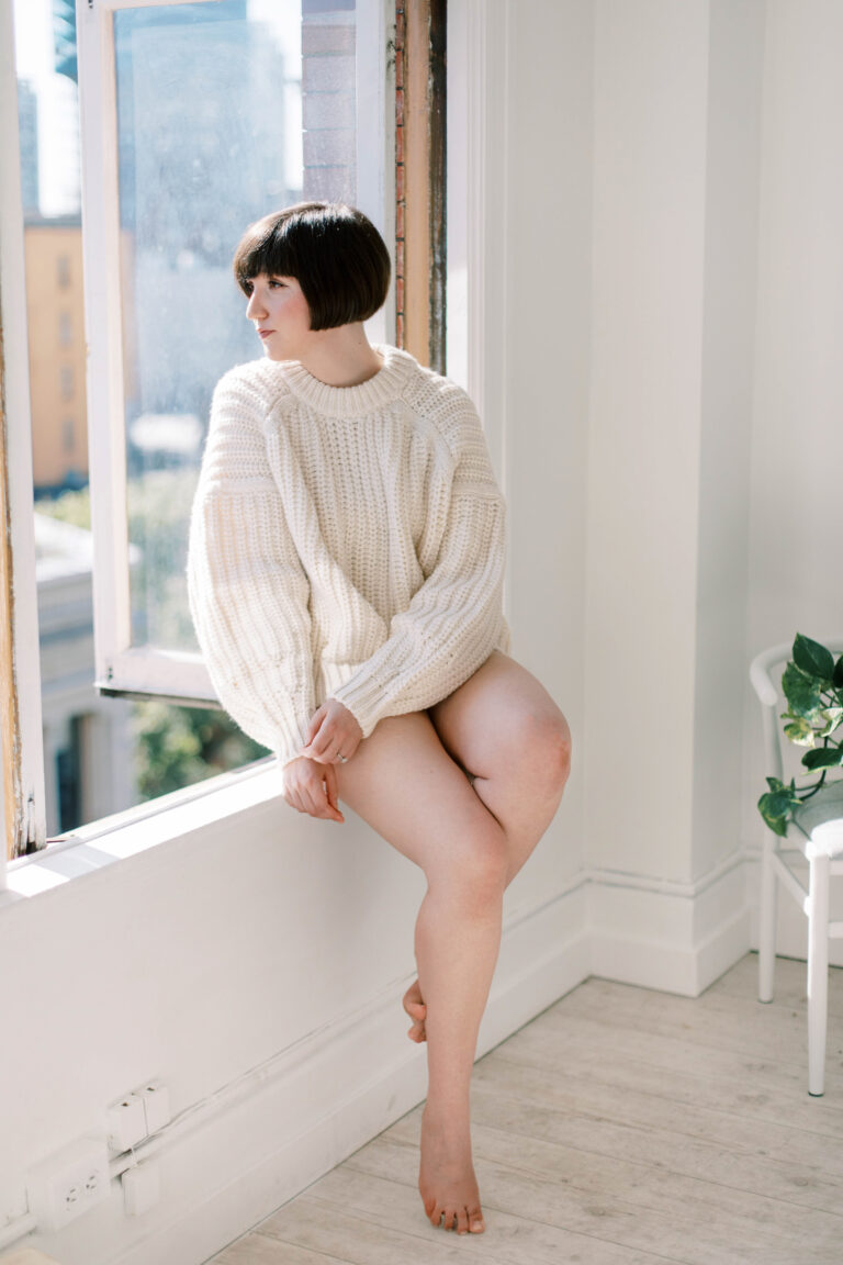 woman looking out a window