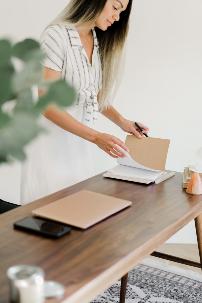 woman setting small goals in a notebook