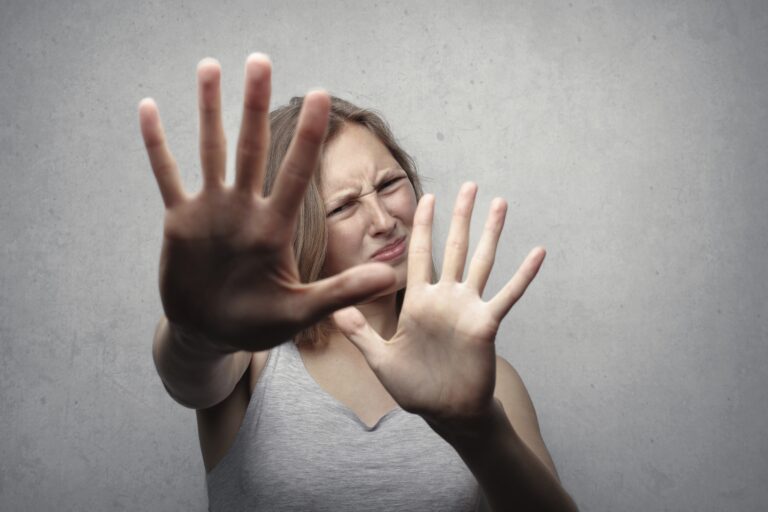 woman pushing back due to fear of change