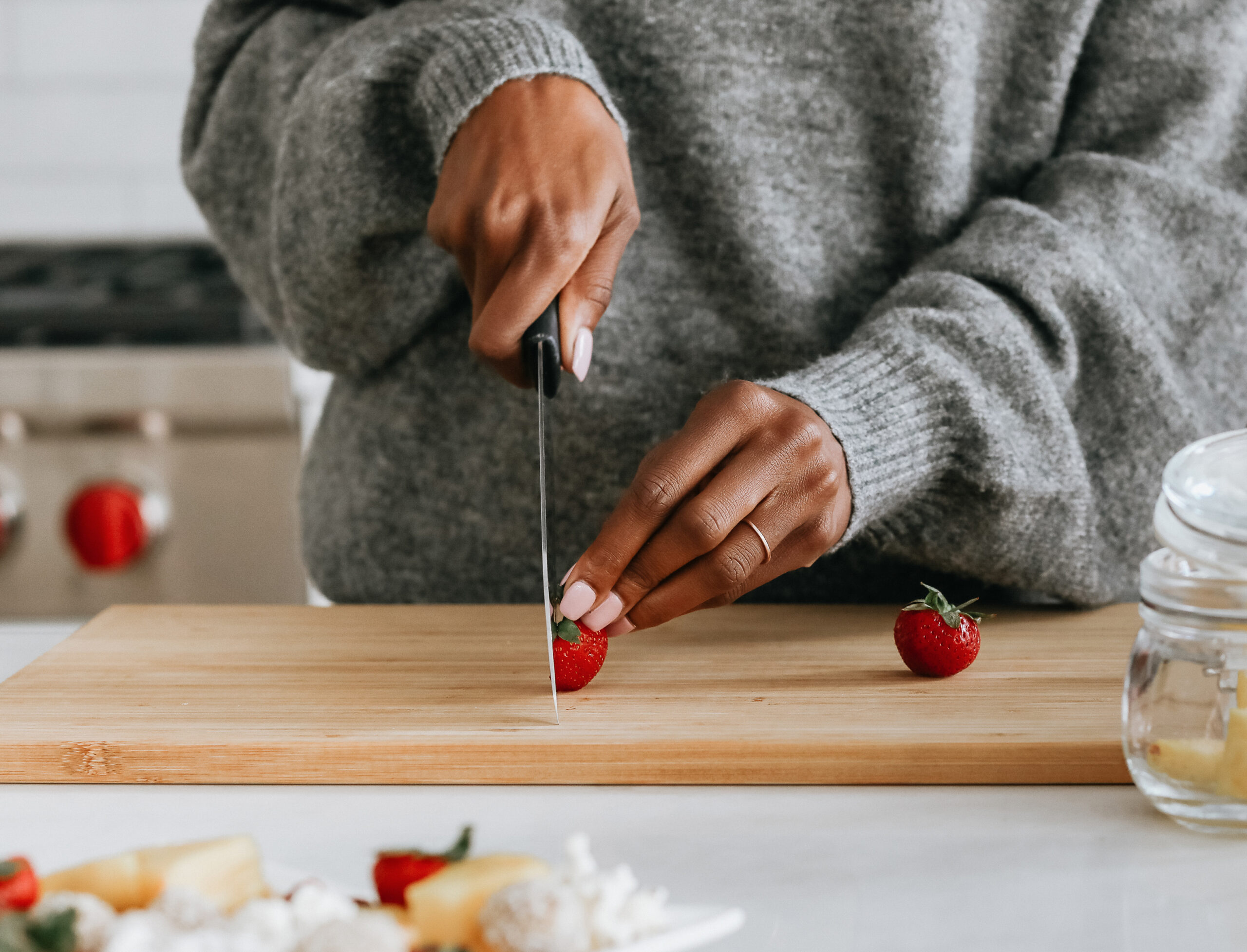 woman slicing strawberries