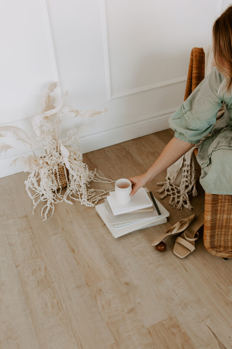 woman reaching for cup of tea