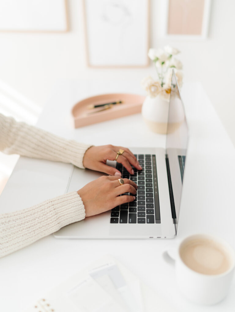 woman tracking goals online so she can stick to her goals