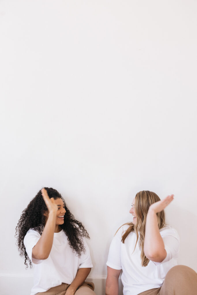 women celebrating small wins to improve self confidence