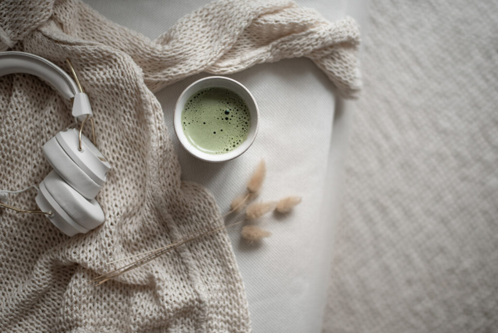 headphones, blanket, green tea
