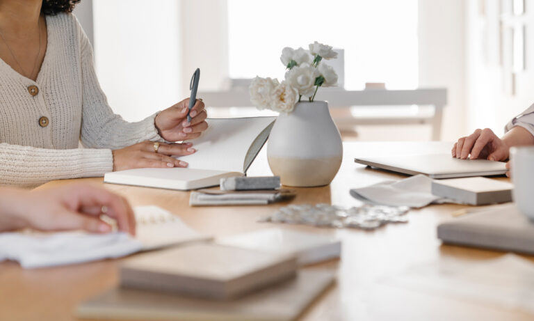 woman planning at a table to gain momentum