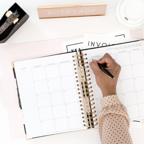 women writing in her planner