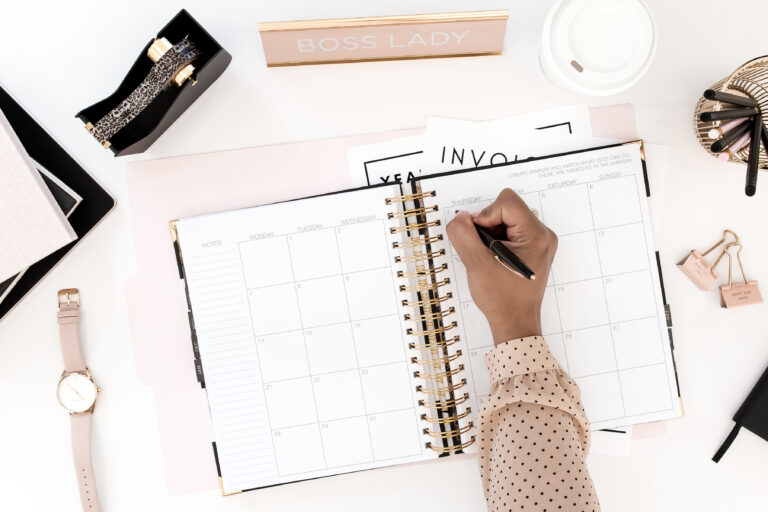 women writing in her planner