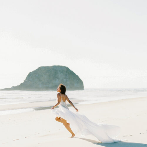 woman running on the beach with positive energy
