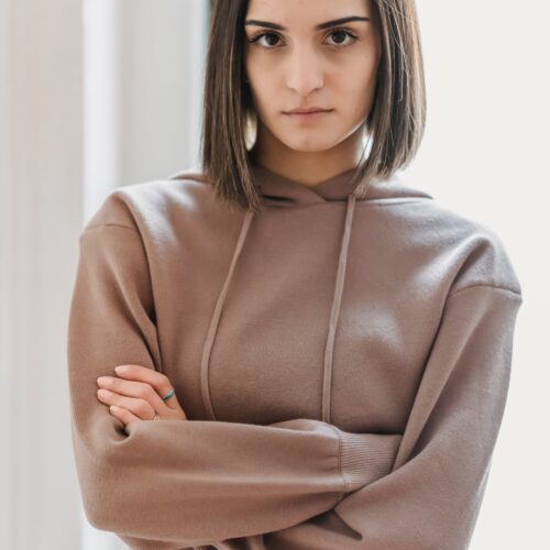 antisocial woman with arms crossed