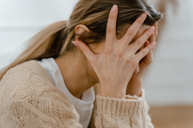 woman with hands on her face