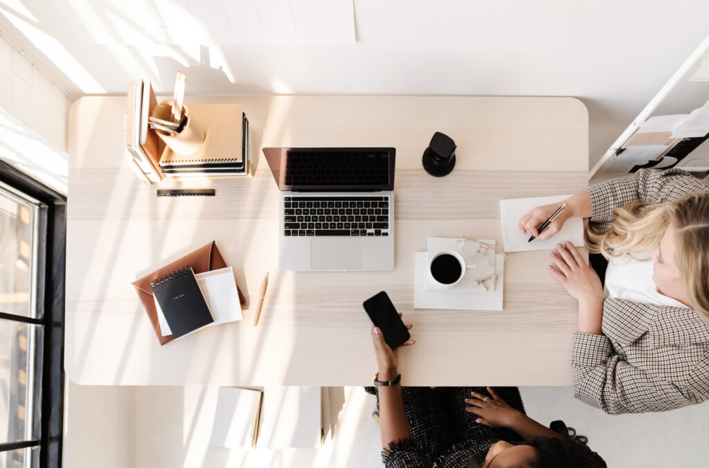 two women at work desk