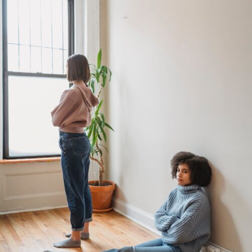 two women arms crossed