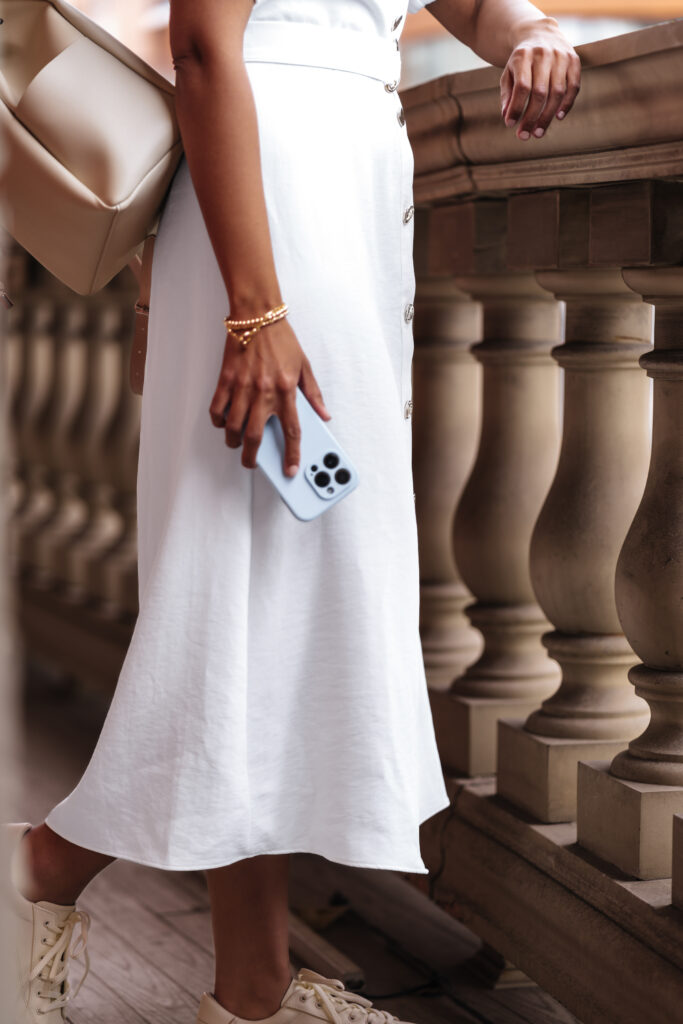 woman standing with cell phone in her hand