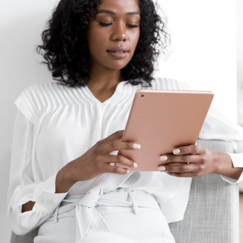 woman looking at an ipad